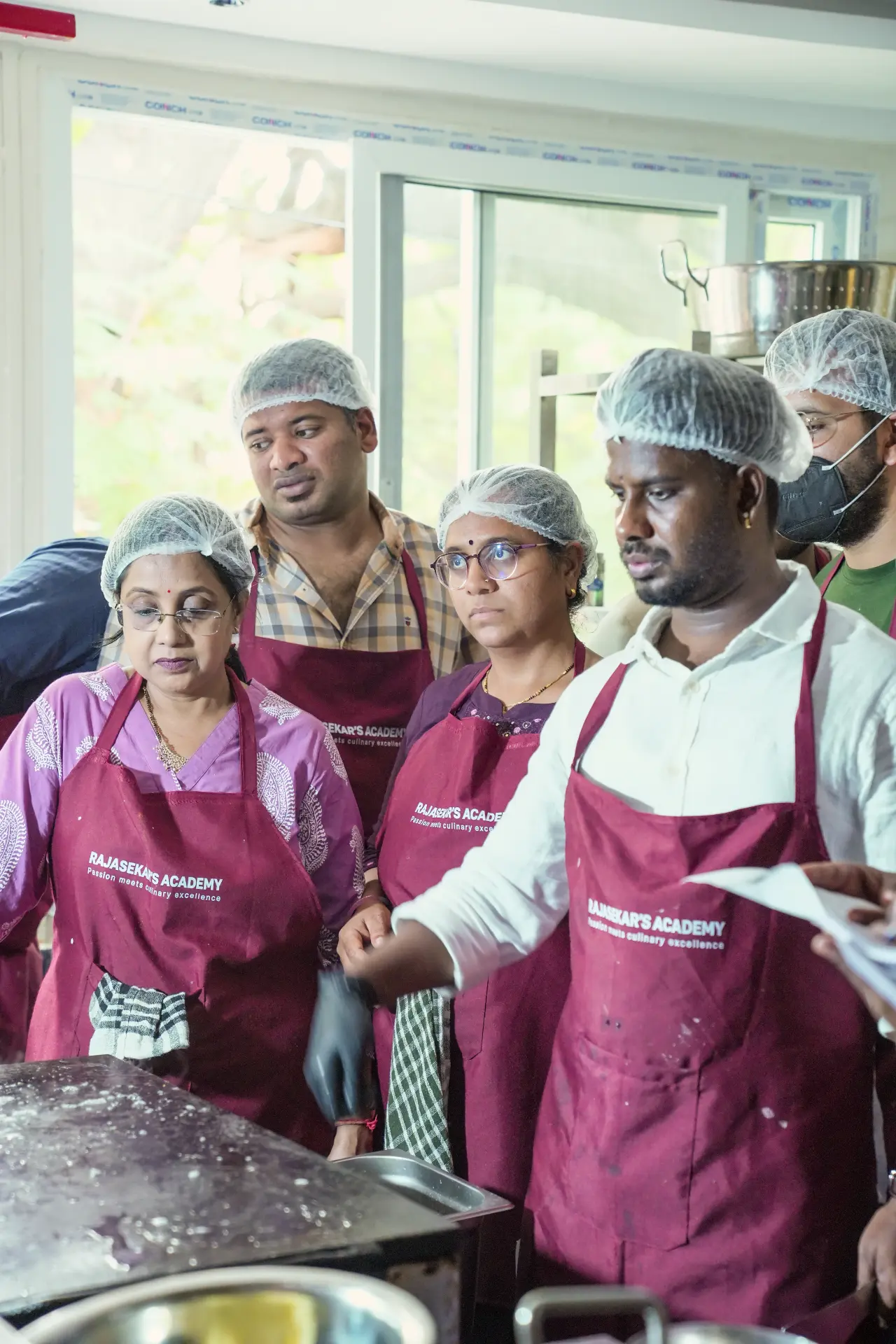 Students watching a live demonstration at Rajasekar's Academy